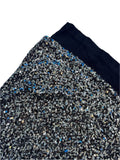 Load image into Gallery viewer, Black sequin fabric with blue accents on a light purple background